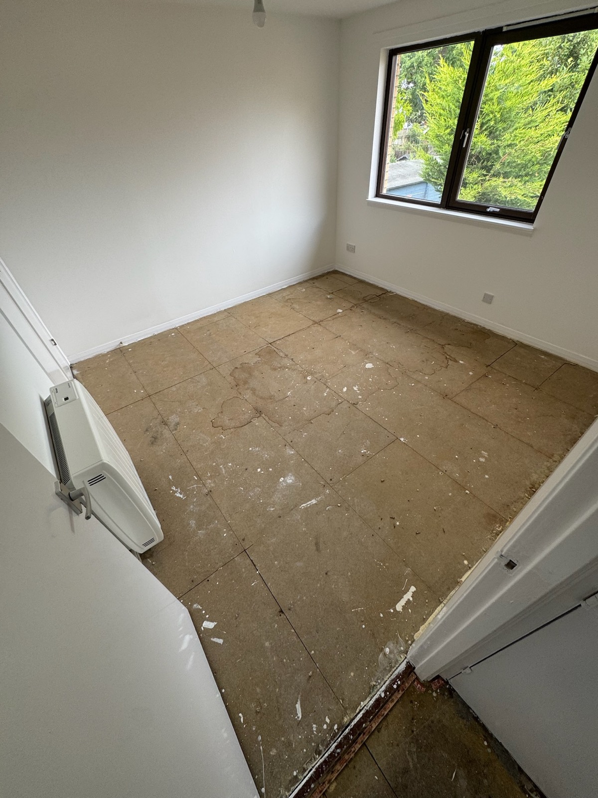 Apartment upstairs bedroom before carpet installation